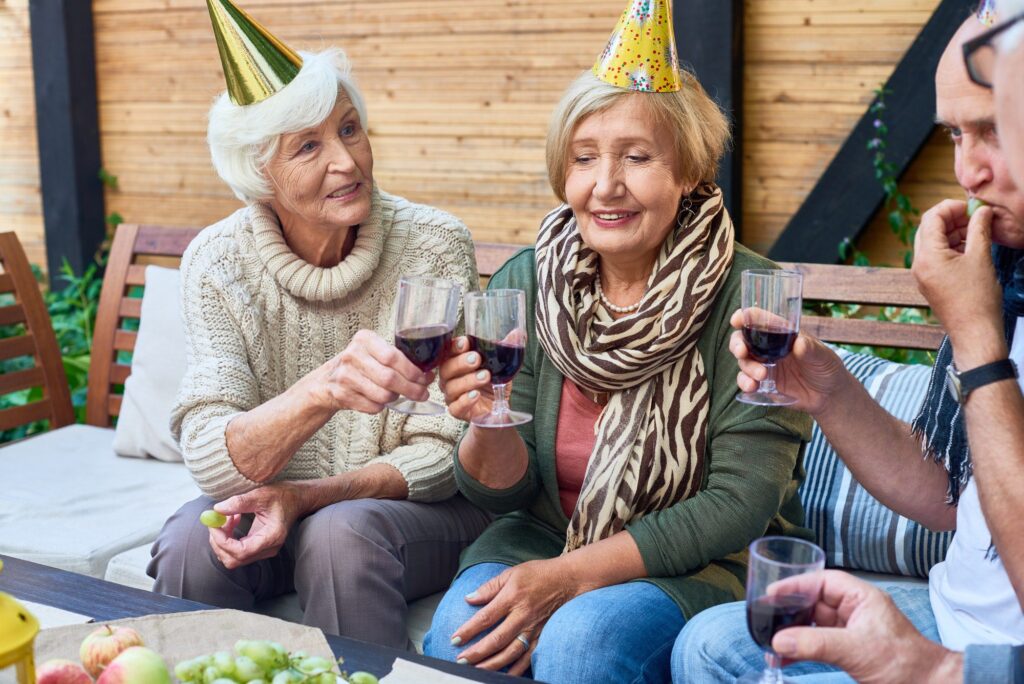 Group of seniors enjoy retirement party for a teacher friend.