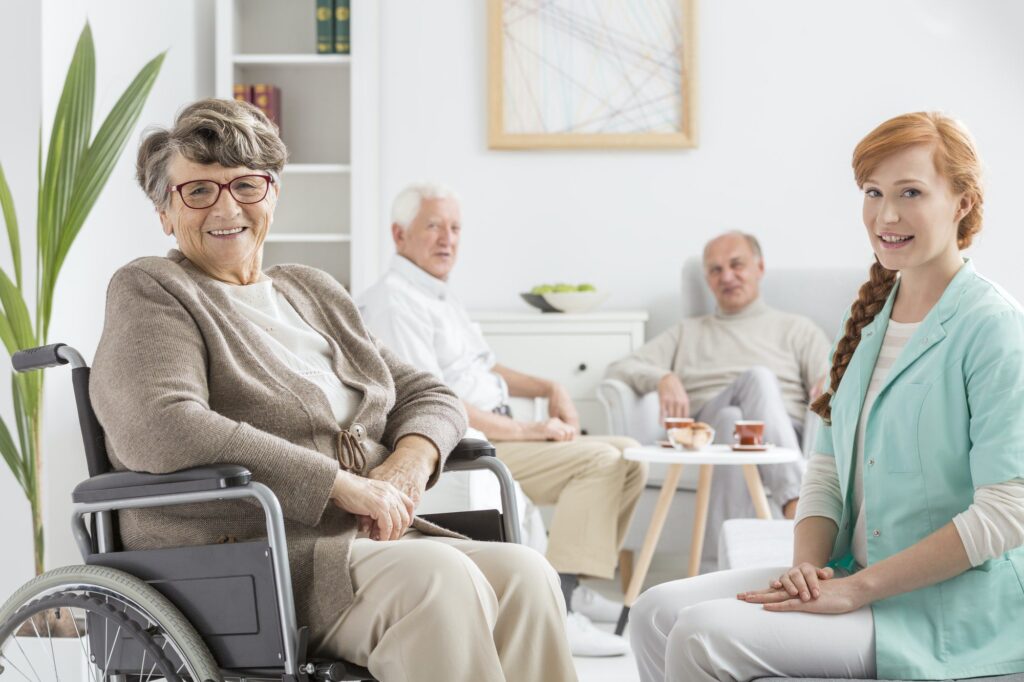 Happy senior gets visit from favorite insurance agent to talk about Welcome To Medicare Visit