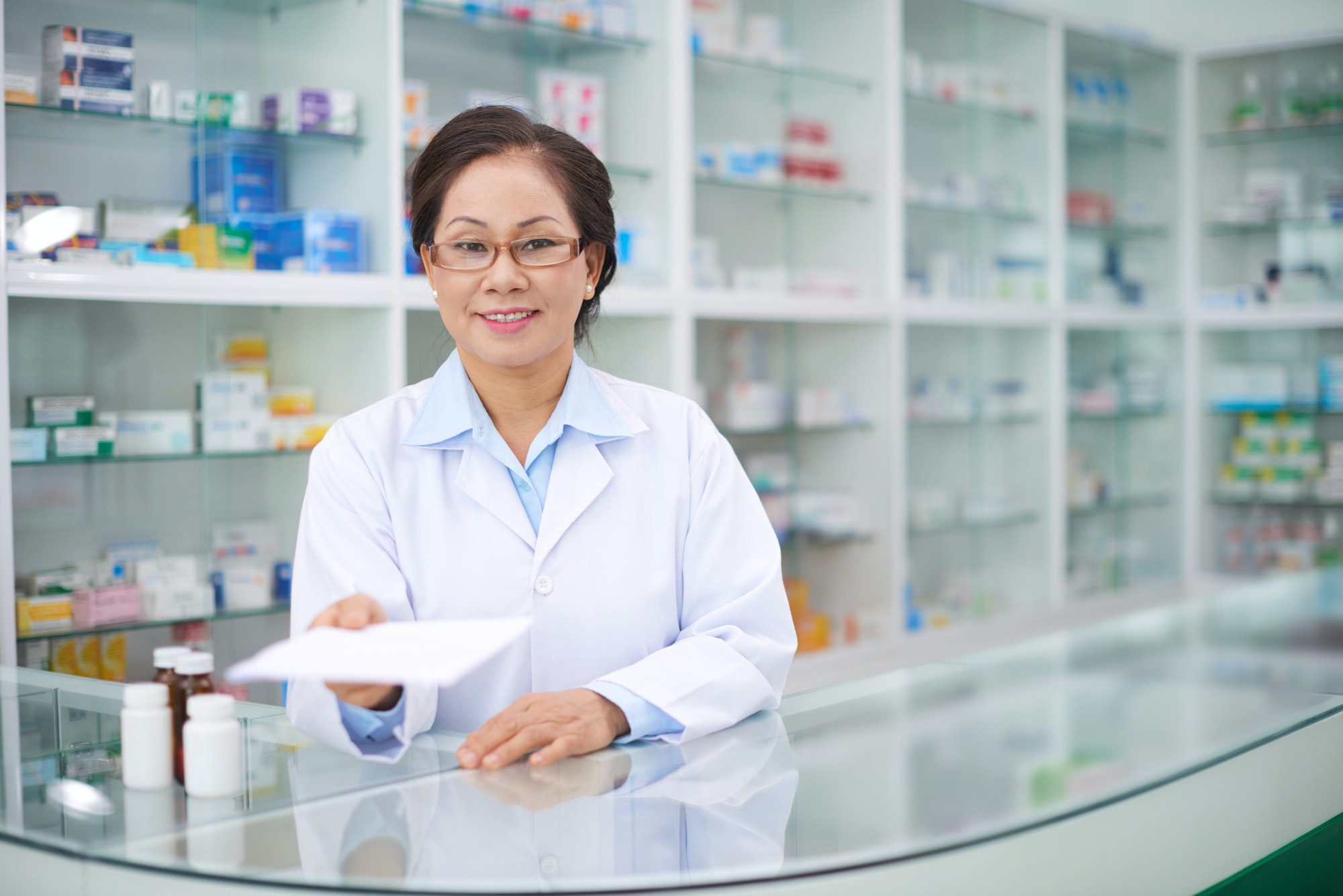 A Pharmacist giving a prescription not Understanding Medigap Plan N