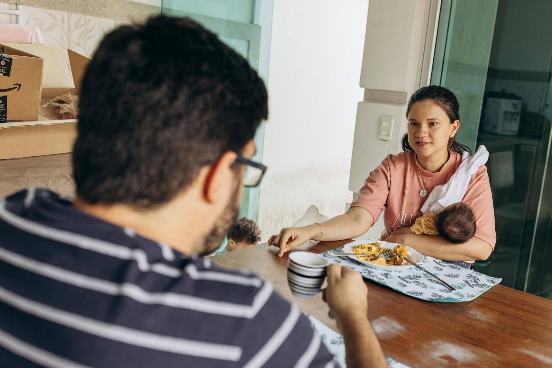 Houston family at the kitchen table reviewing 2026 ACA Marketplace SEP options after a qualifying life event