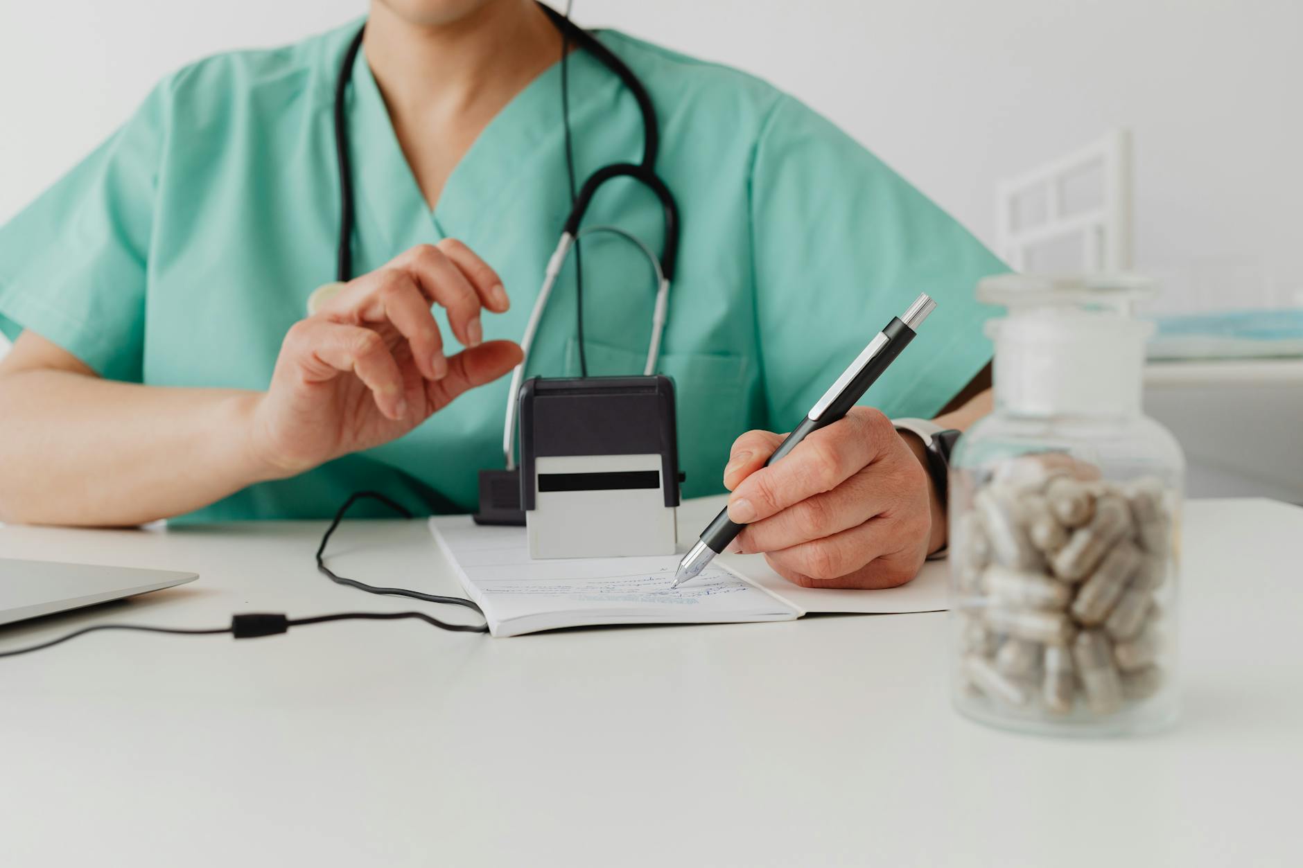 Houston senior reviewing a Wegovy prescription with a pharmacist at a pharmacy counter in Bellaire while discussing Medicare Part D coverage and the $2,100 out-of-pocket cap