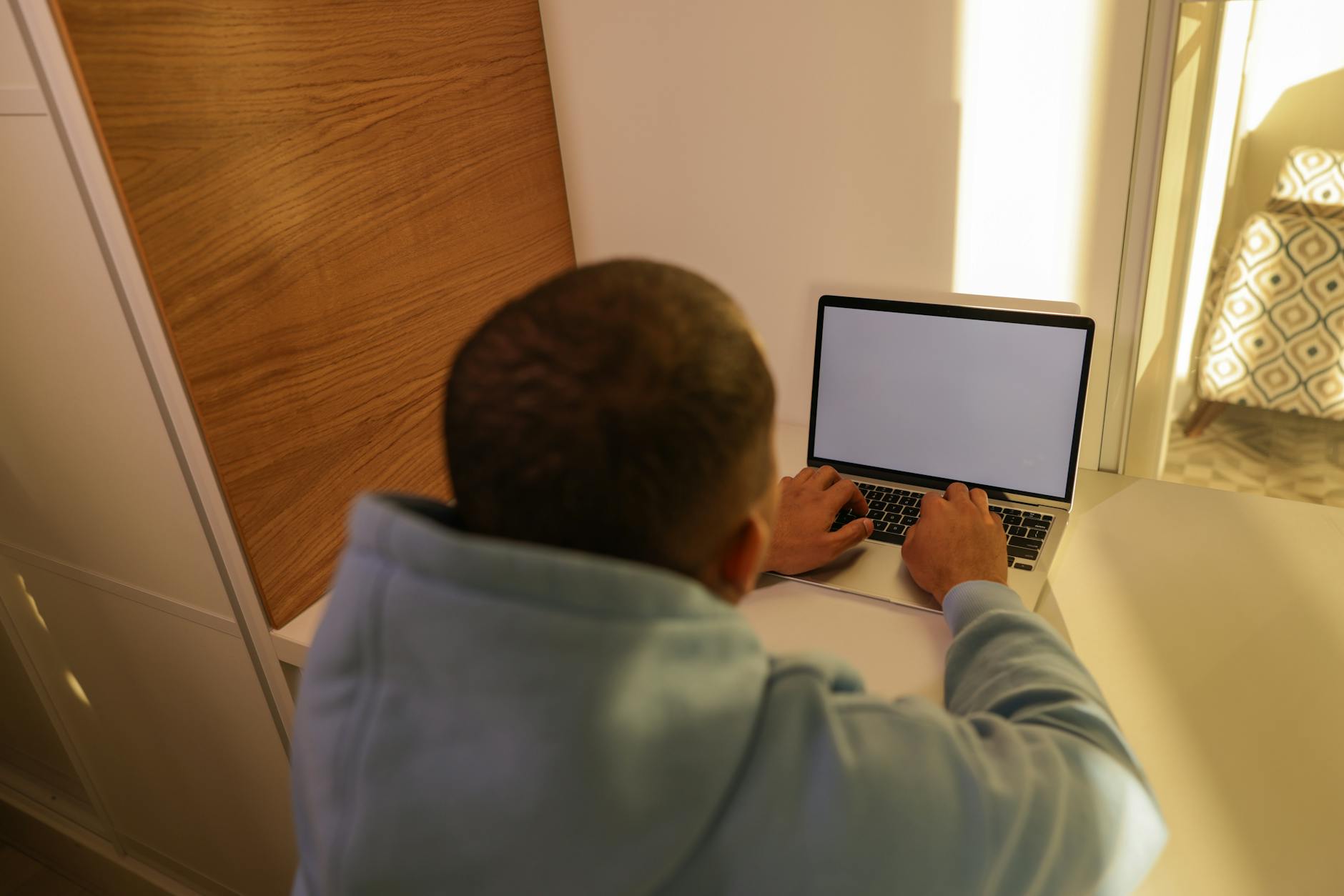 Self-employed Houston freelancer reviewing 2026 health insurance options on a laptop
