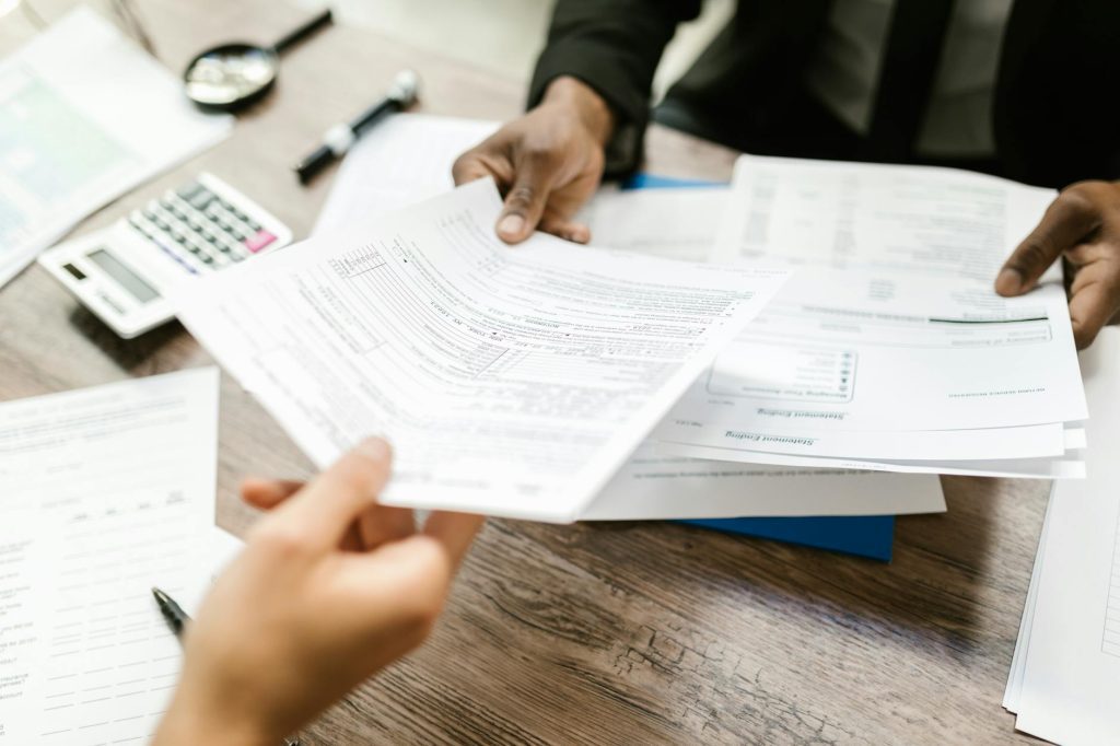 Houston family reviewing health insurance paperwork at a kitchen table