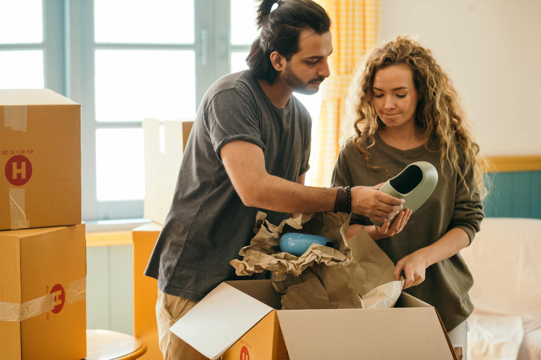 A Houston family at a moment of life change - moving into a new home - one of the qualifying life events that triggers an ACA Special Enrollment Period.
