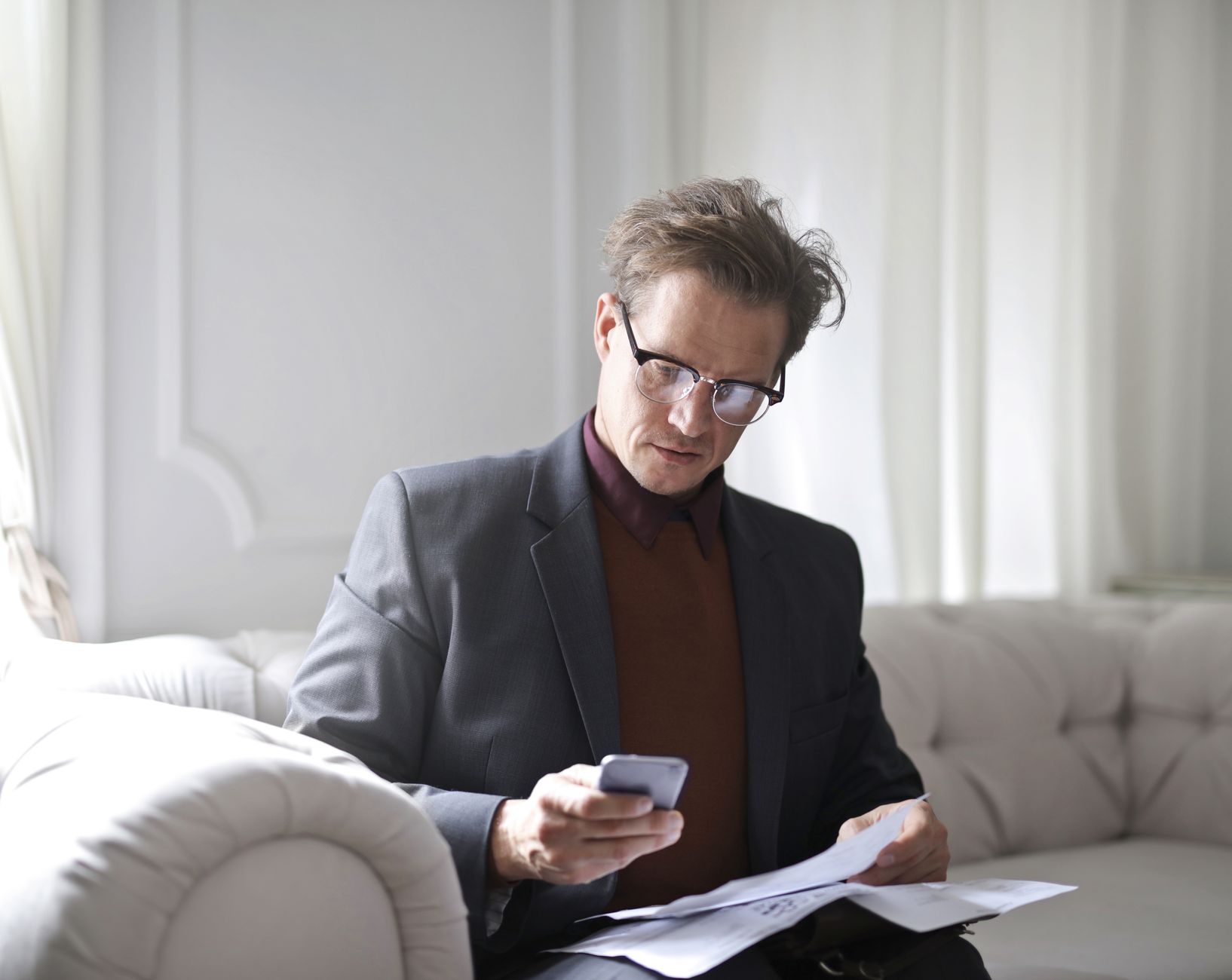 A Houston retiree reviewing a Medicare late-enrollment penalty notice at home