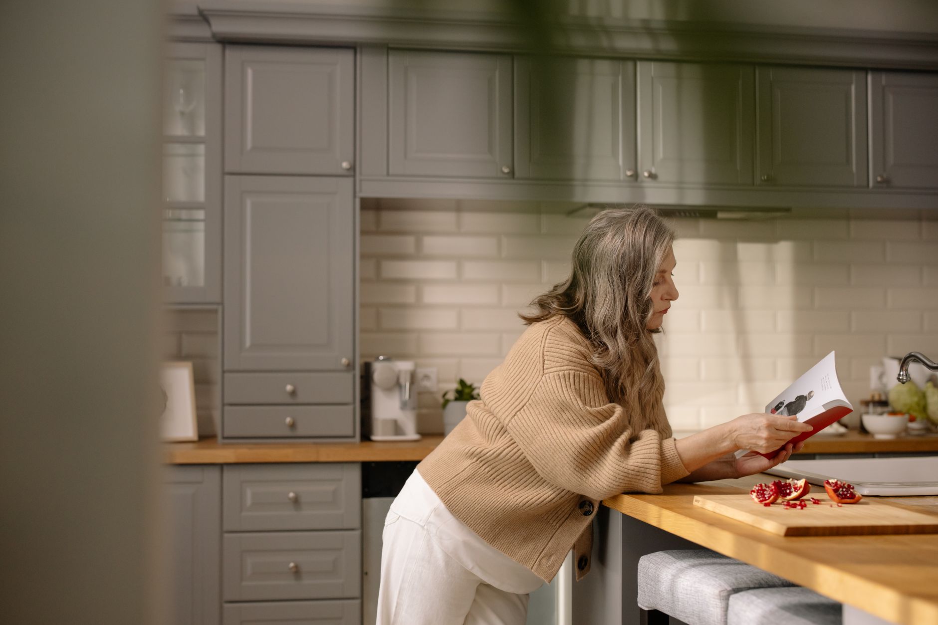 A Houston retiree reviewing a Medicare late-enrollment penalty notice at home
