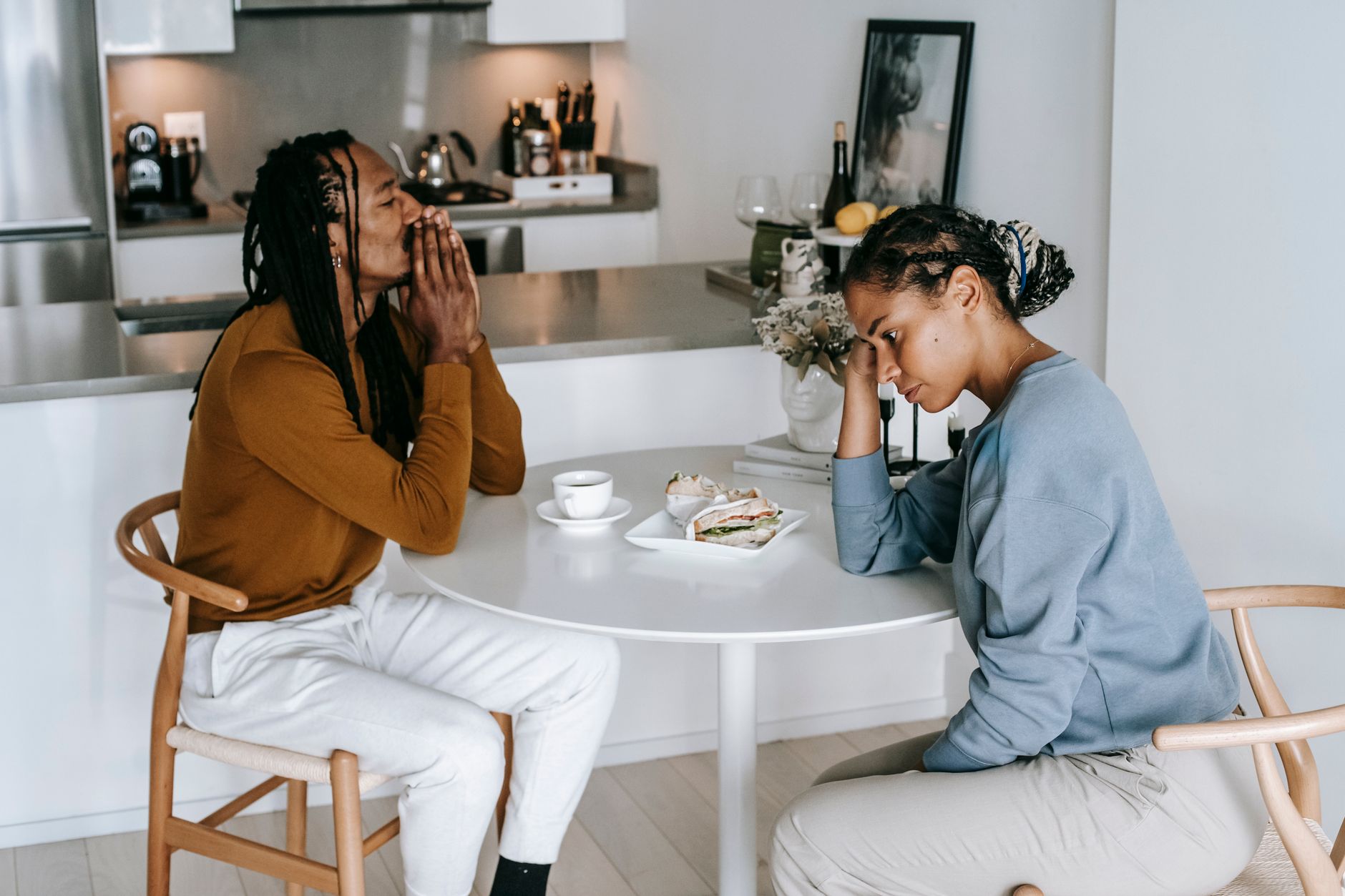 Houston couple in their late fifties reviewing a 2026 Marketplace premium notice at their kitchen table after losing their ACA premium tax credit
