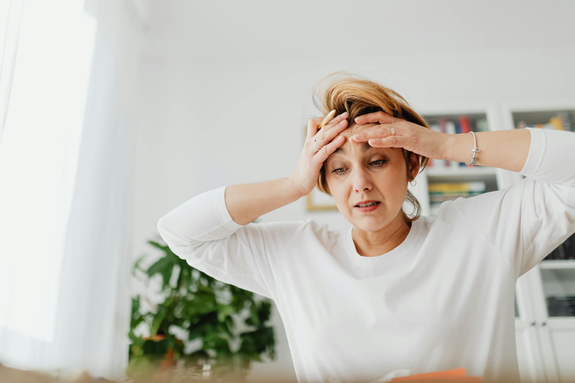 A Houston parent reviewing a Texas Medicaid termination notice alongside Marketplace coverage options