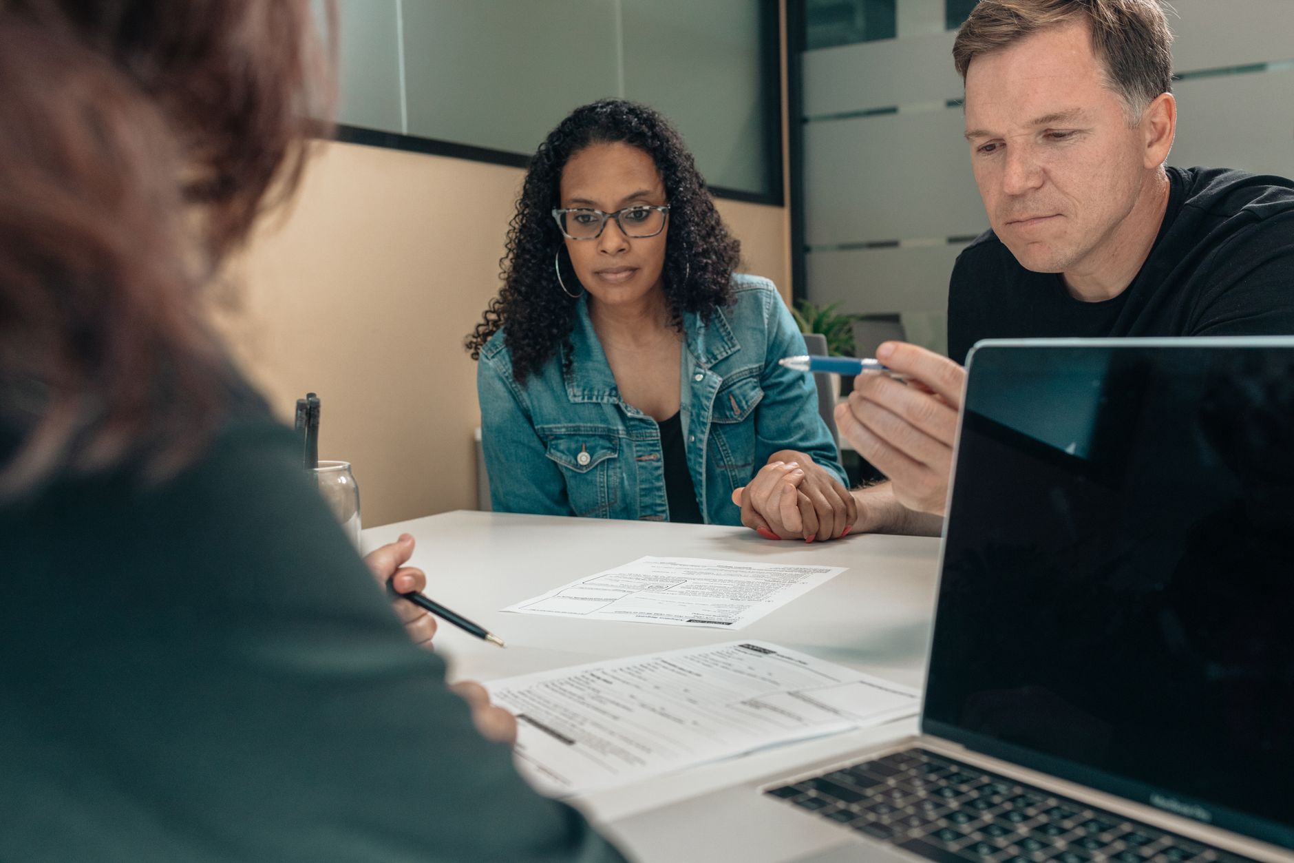 A Houston family weighing job-based coverage against a Marketplace plan after the family-glitch fix