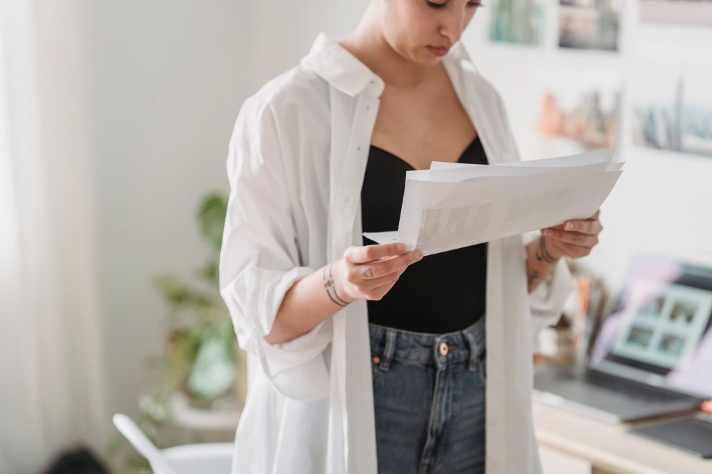 Houston resident weighing a short-term health plan against an ACA Marketplace plan at home