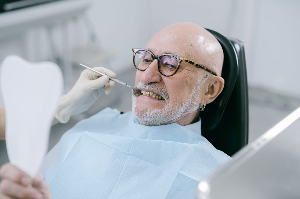 Houston Medicare Advantage member using dental, vision, and hearing benefits at a clinic