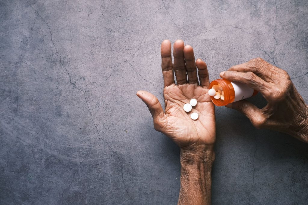 Houston senior reviewing Part D prescription costs and Extra Help savings in 2026