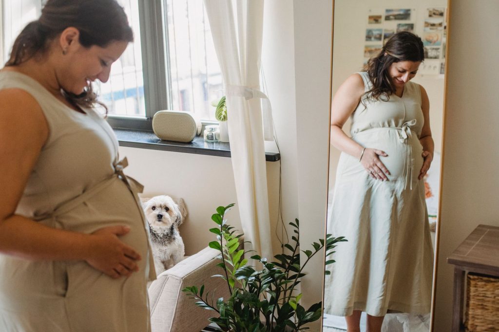Houston parents at home with their infant after adding the baby to a health plan