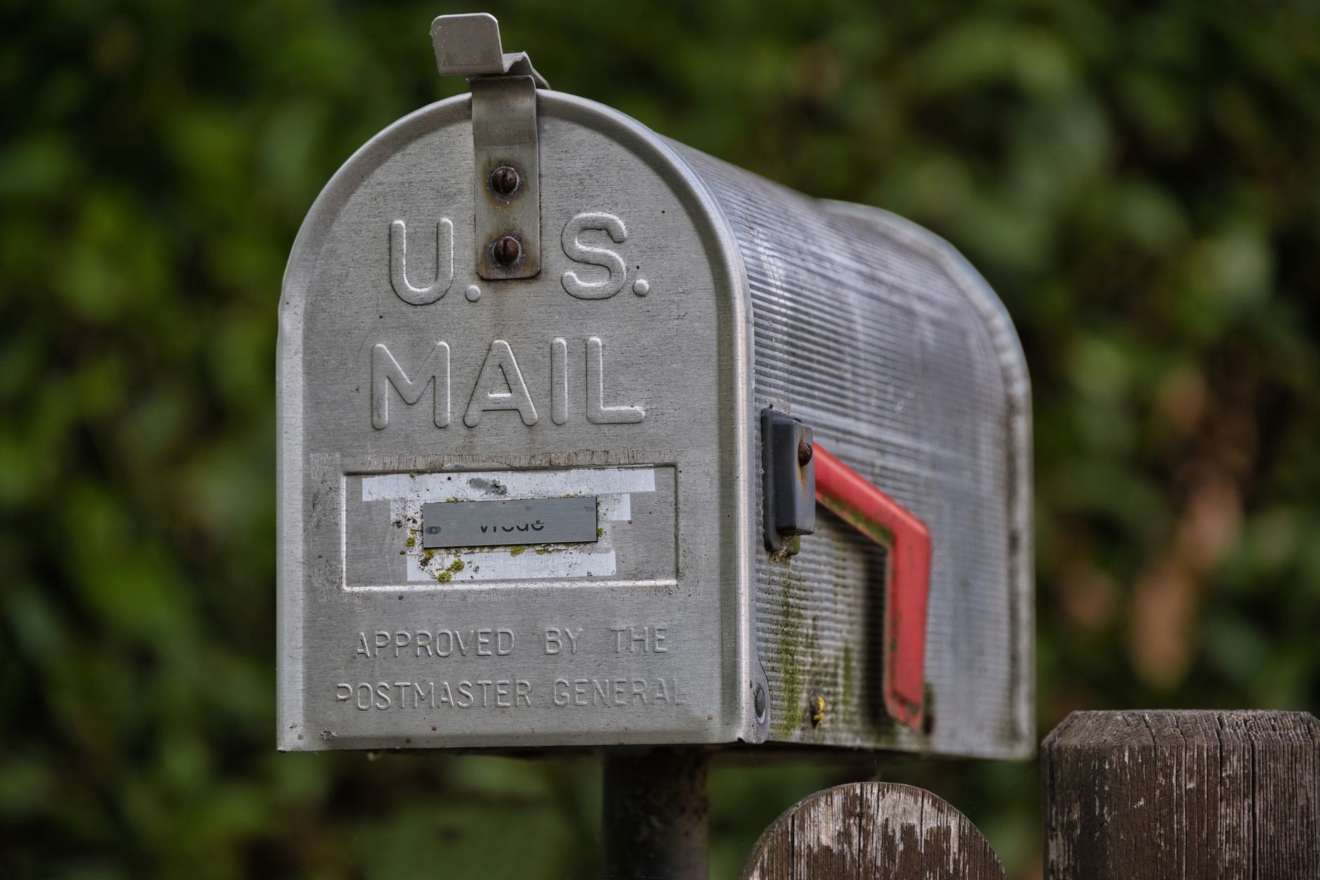 A U.S. curbside mailbox with the flag up outside a home, the way it looks through a Houston Medicare season.
